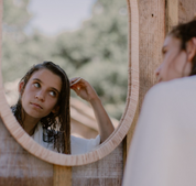 a girl combing her wet hair