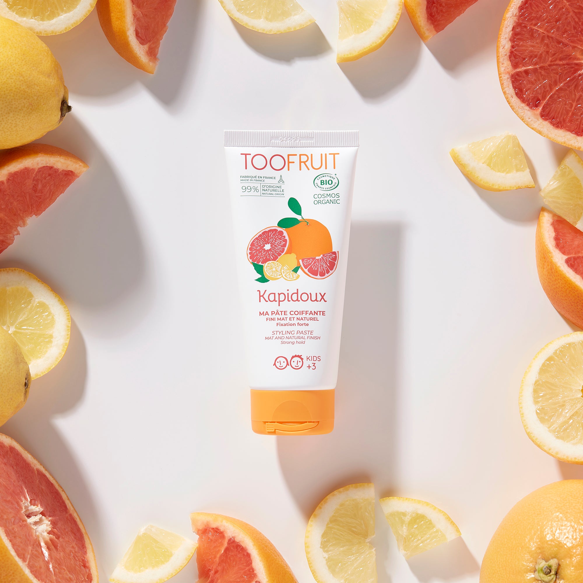 a tube of toofruit hair styling paste and its ingredients
