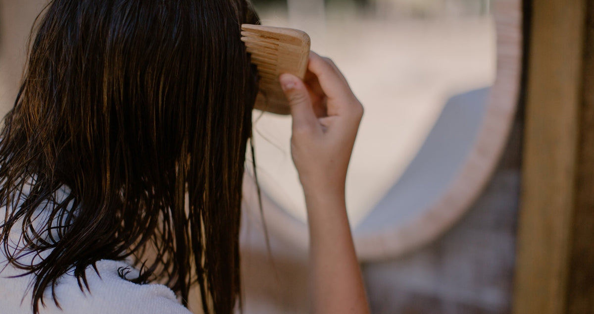 girl combing hair