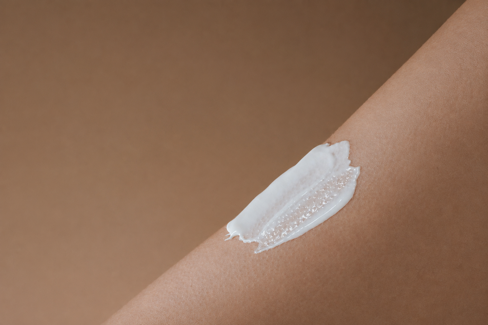 moisturising cream on arm