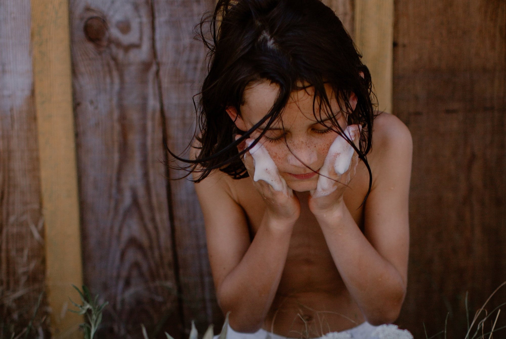 a child washing his face
