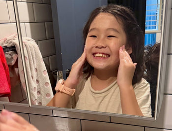 Pre-teen washing her face