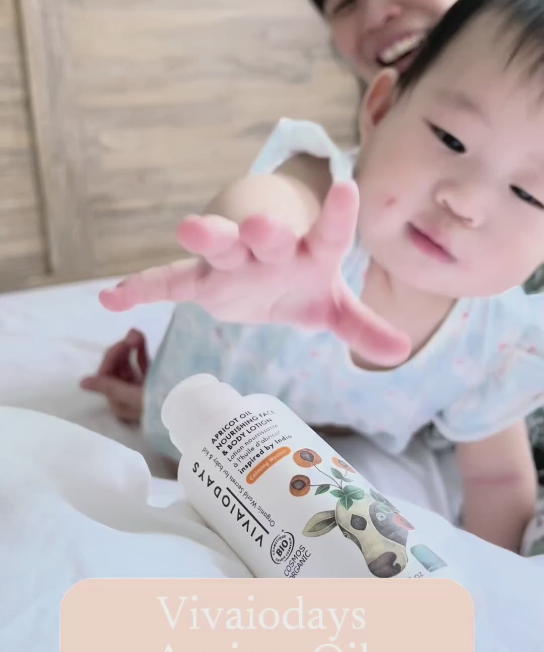a video of mother using apricot face and body lotion on baby
