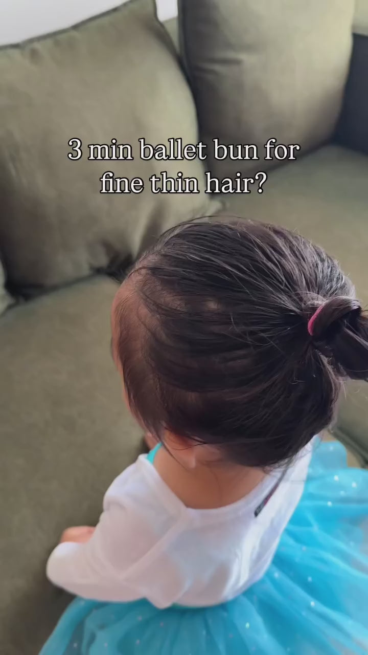 using the smooth and style set made up of toofruit detangling spray and toofruit hair styling paste to create an effortless ballet bun