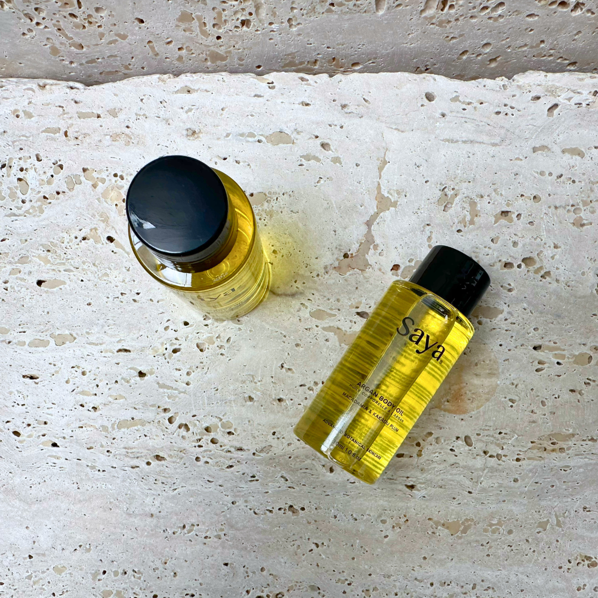 two bottles of mini saya argan body oil