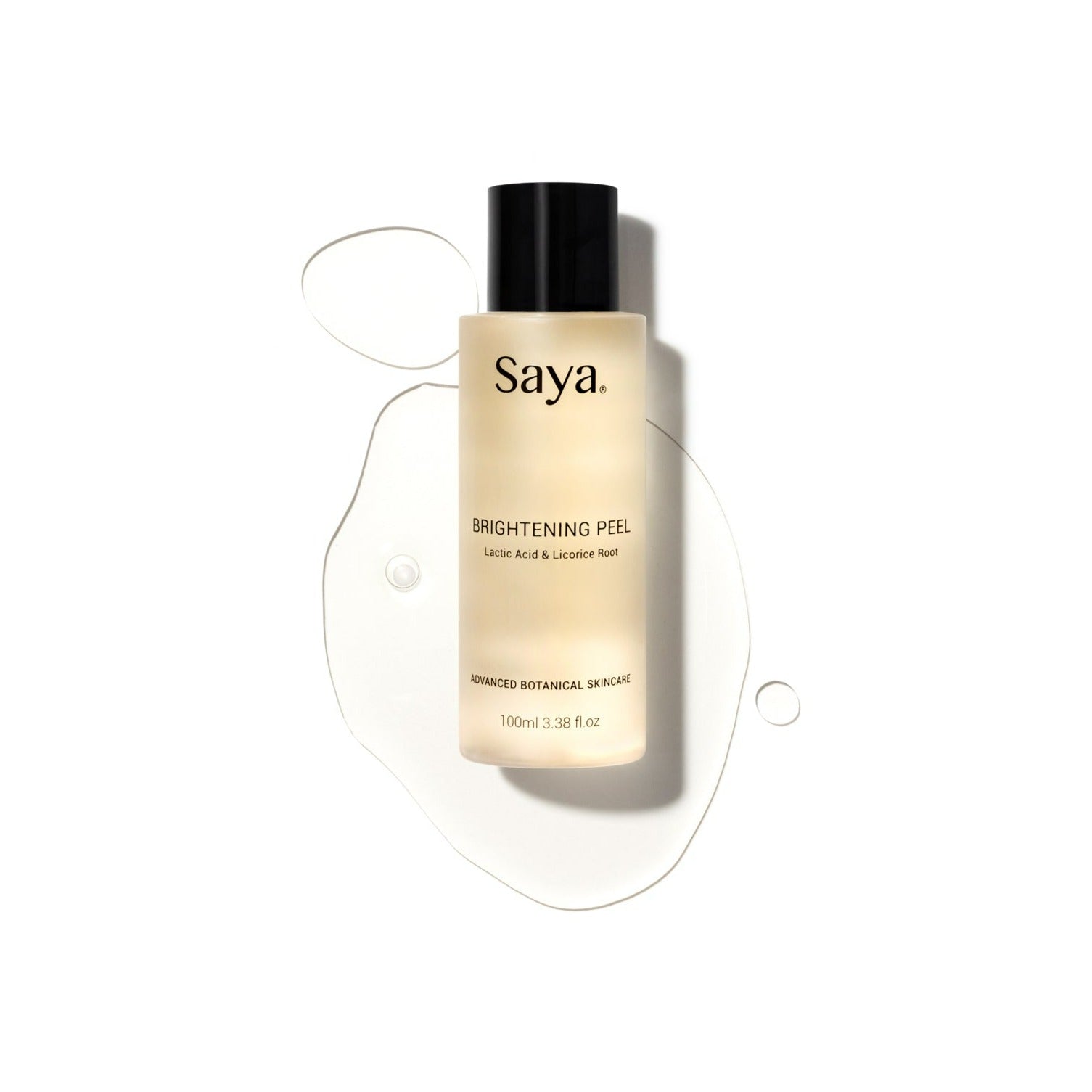 a bottle of saya brightening peel laying on a puddle 