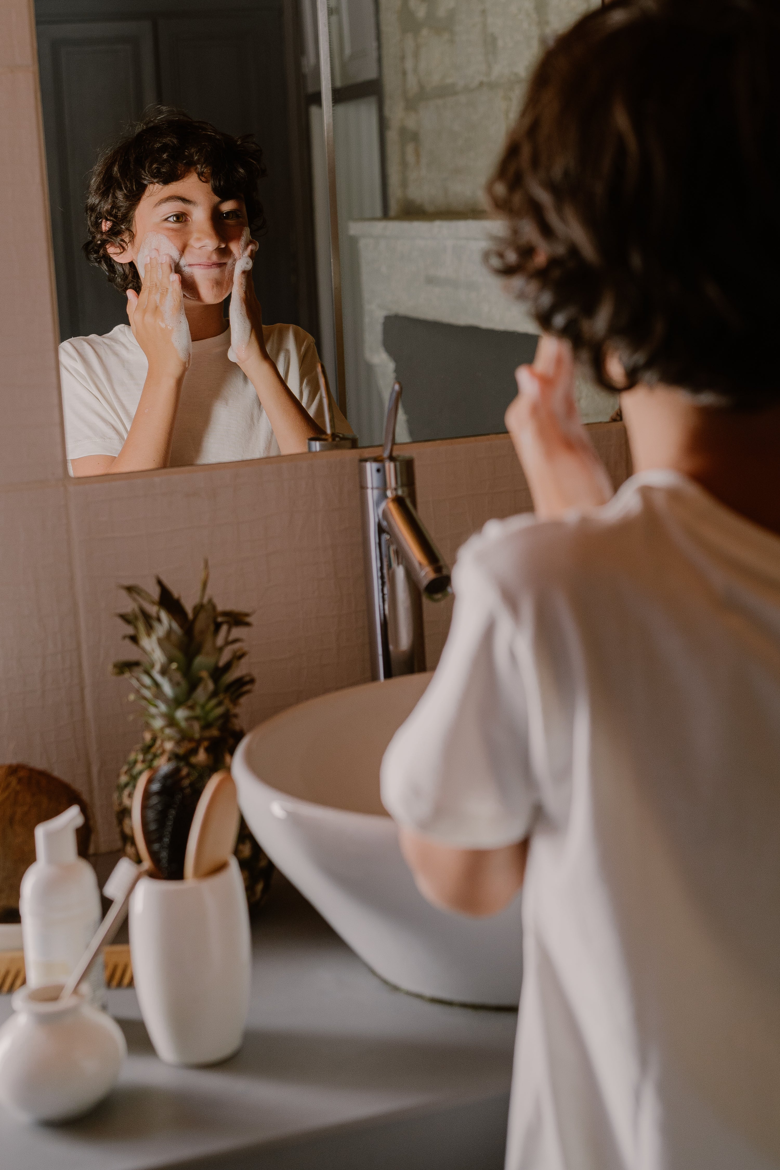 a boy washing his face
