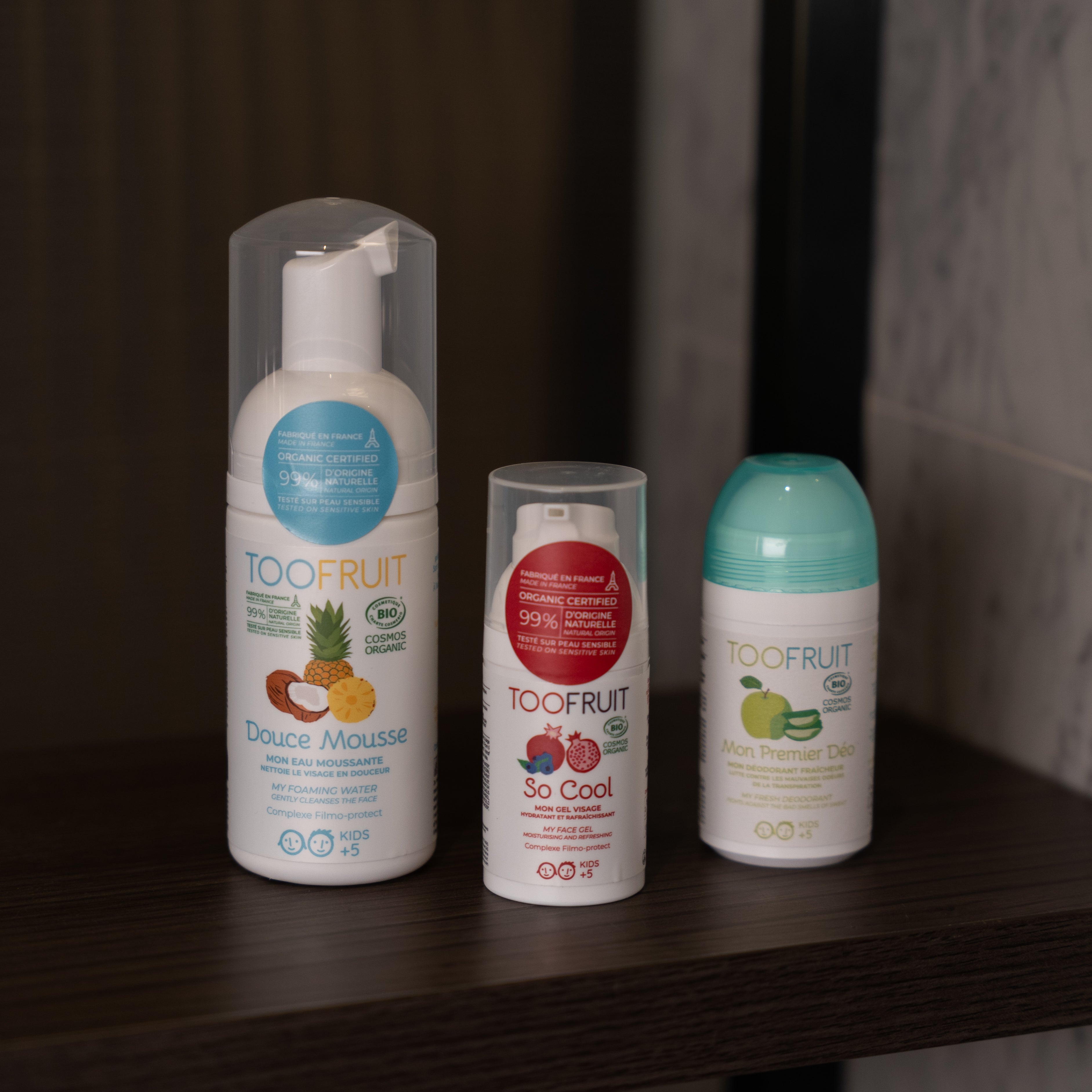 a bottle of toofruit douce mousse, so cool and apple deodorant on a shelf
