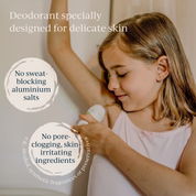 a girl using toofruit deodorant on her underarm