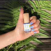 a hand holding toofruit blueberry nail polish