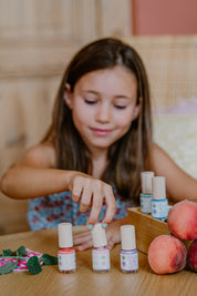a girl using toofruit nail polish