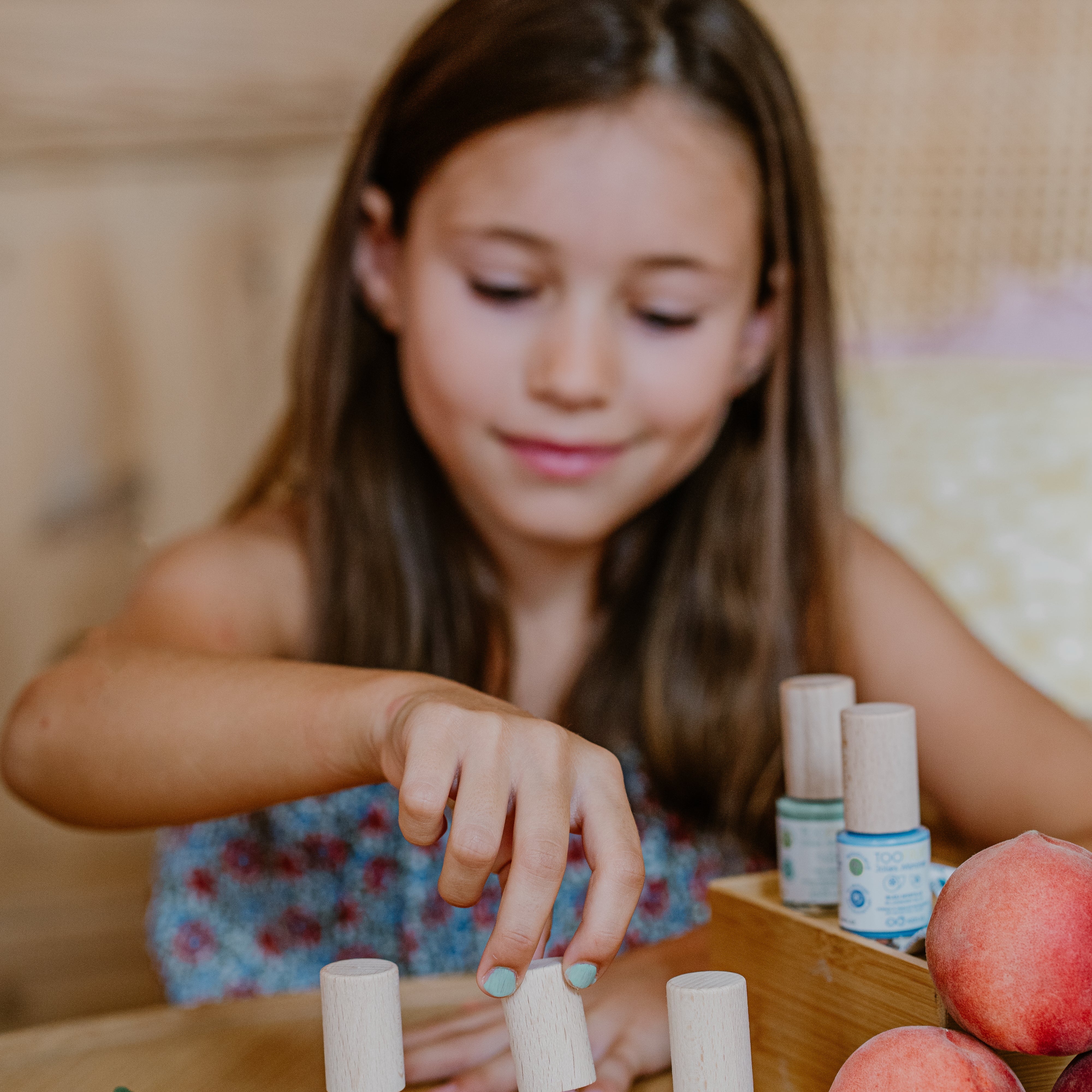 a girl using toofruit nail polish