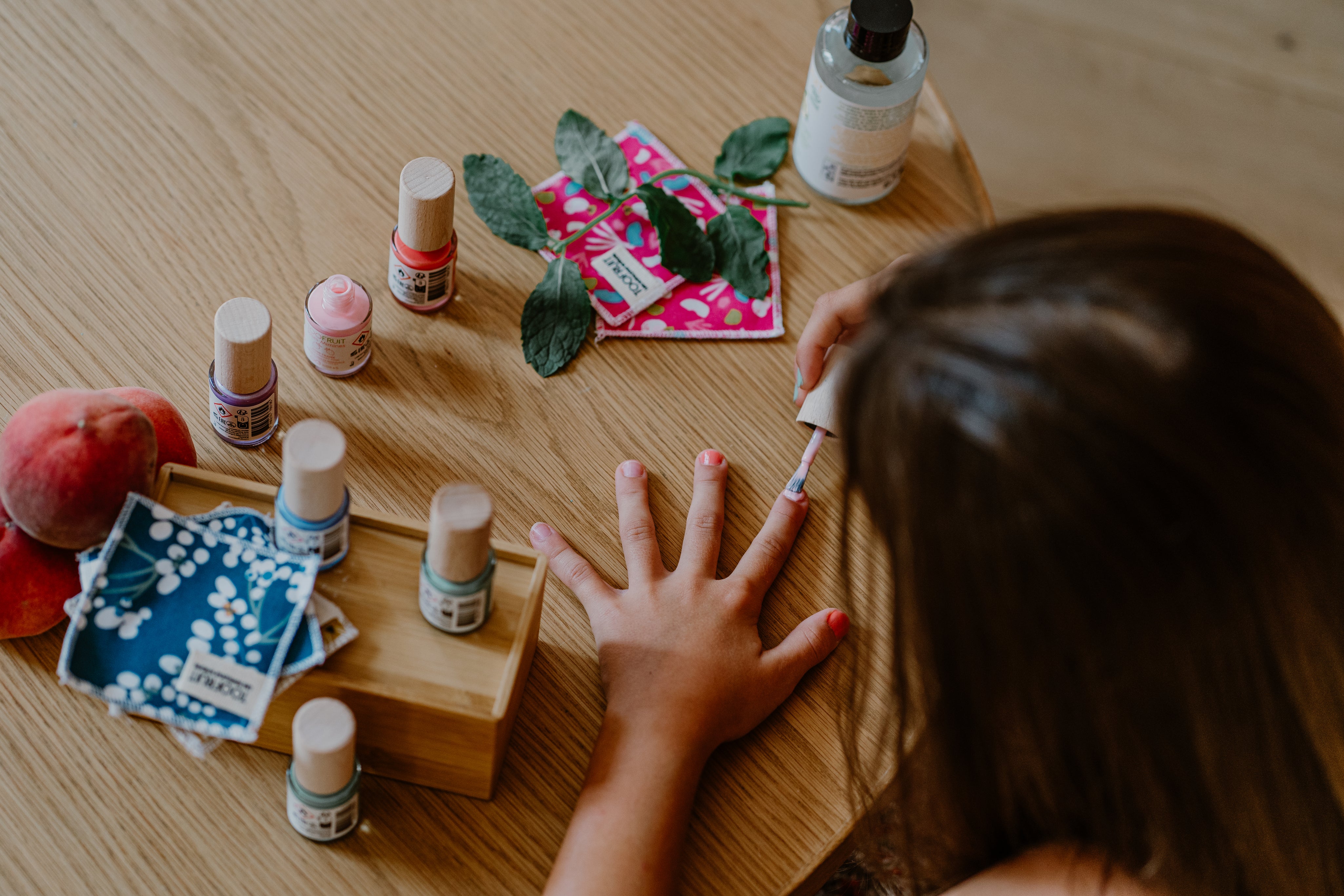 a girl painting her nails