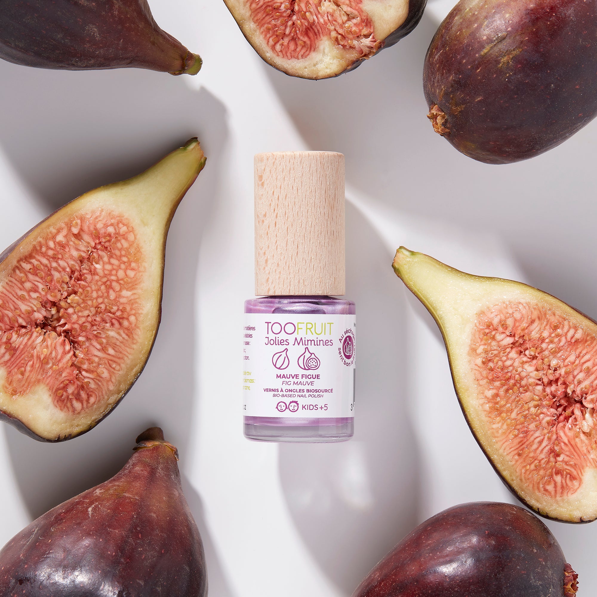 a bottle of toofruit fig nail polish and figs