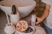 a bottle of toofruit so cool in a bathroom