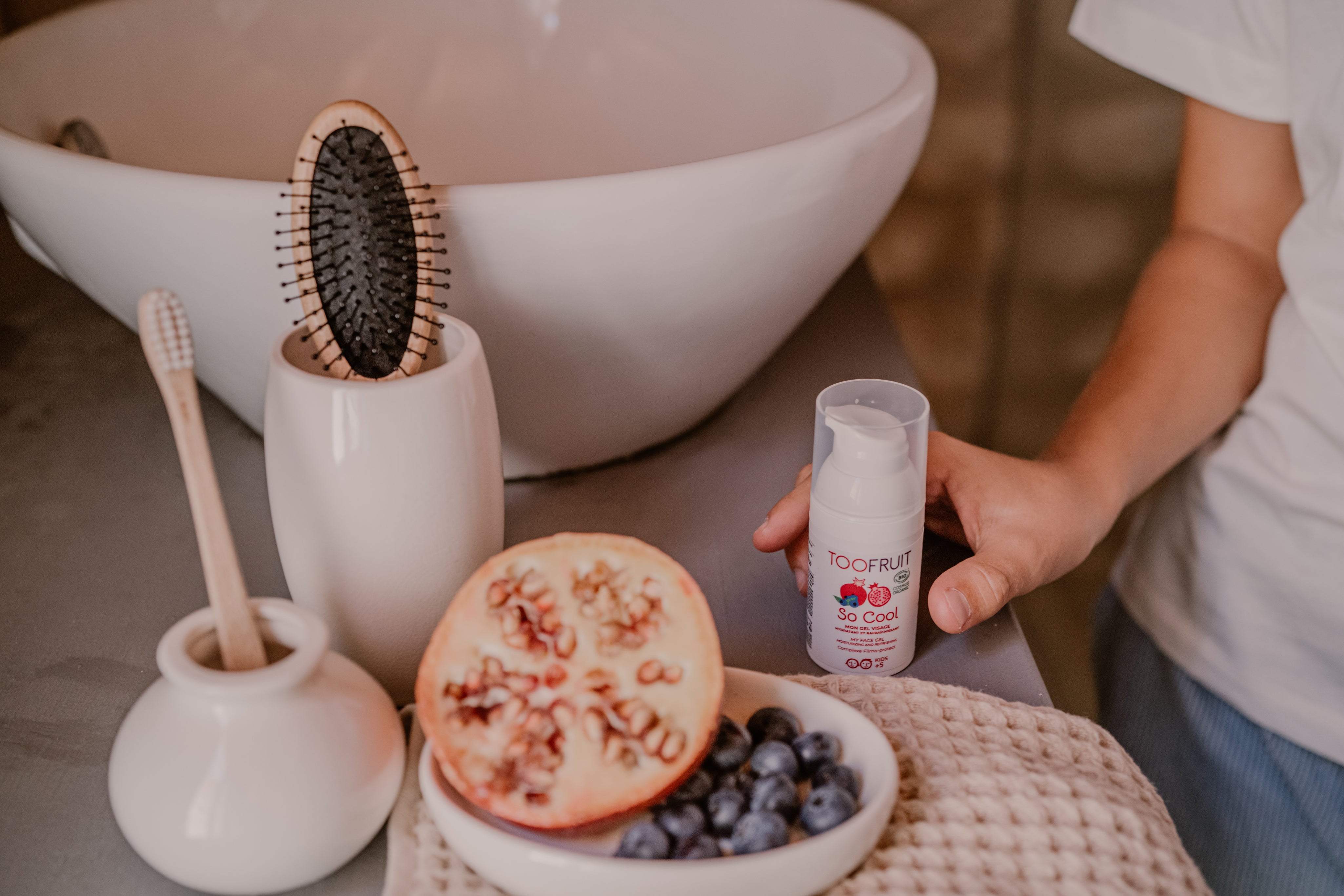 a bottle of toofruit so cool in a bathroom