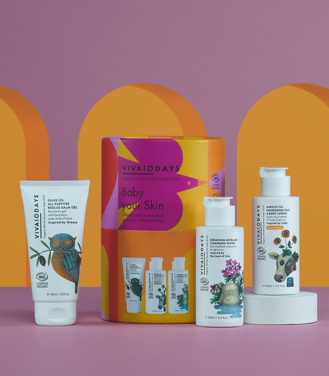 a tube of vivaiodays olive oil balm gel, a bottle of rose geranium micellar cleansing water and apricot oil face and body lotion and cylindrical gift packaging