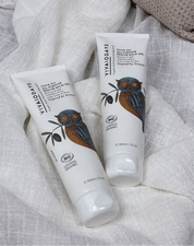 Two tubes of VIVAIODAYS by IYLA COLLECTIVE skincare product on a textured fabric background