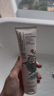 a video of children in a bath tub with saponaria wash and shampoo