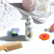 a bottle of vivaiodays tsubaki leave in detangler and conditioner on a table