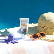 a tube of vivaiodays turmeric sunscreen by the pool